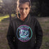 Featuring a stunning graphic of a majestic snowy owl in flight, set against the glowing northern lights, this hoodie embodies the freedom and grace of the province’s untamed wilderness.